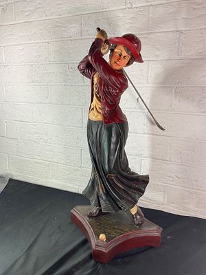 Painted Golfing Lady Figurine on Wooden Base. Figural sculpture depicting a woman mid-swing in