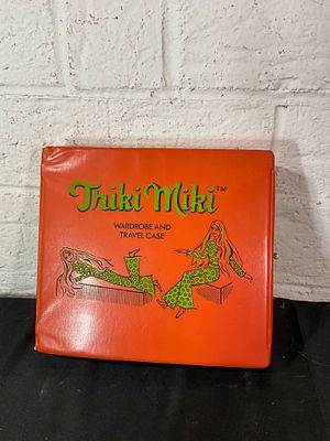 Triki Miki Wardrobe and Travel Case Set. A Triki Miki wardrobe and travel case in a vibrant