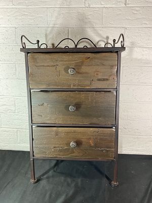 Metal and Wood Three-Drawer Cabinet. A three-drawer cabinet featuring a wrought metal frame with