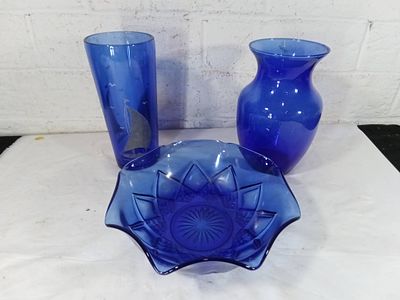Blue Glass Vases and Bowl. Three blue glass items, including two vases and one bowl. The tall 