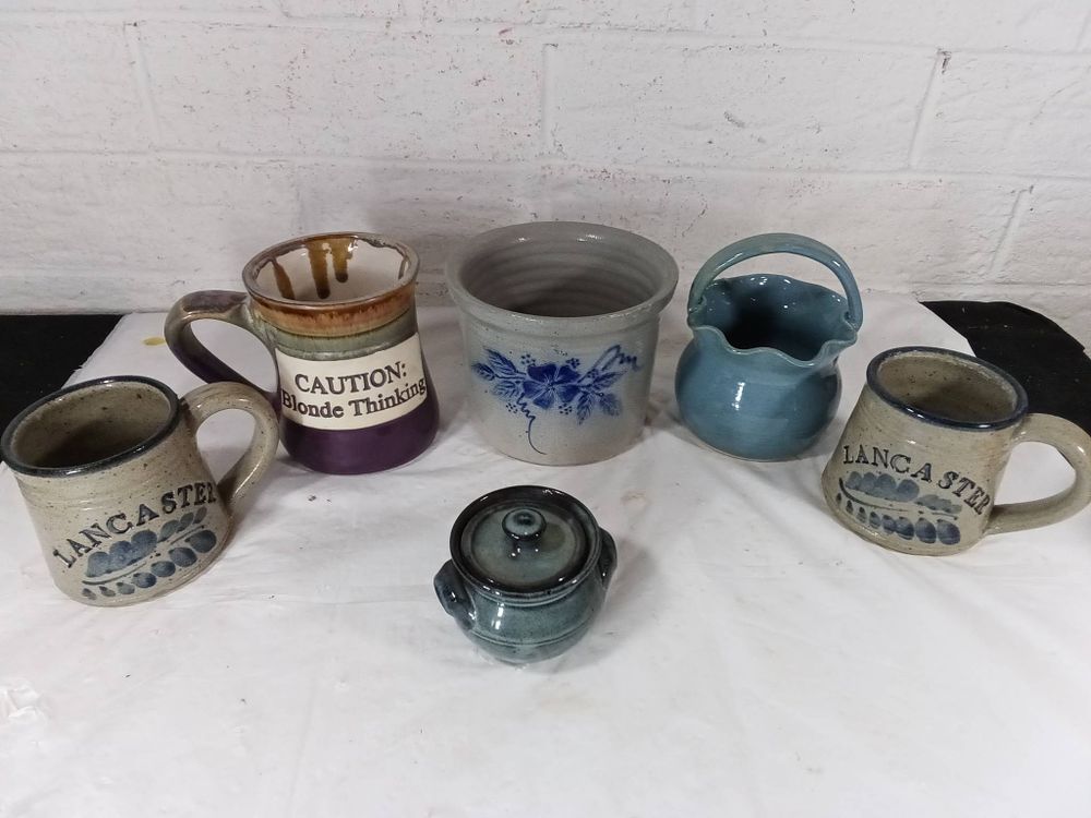 Pottery Items. Six ceramic pottery items including mugs, a small handled pitcher, a lidded 