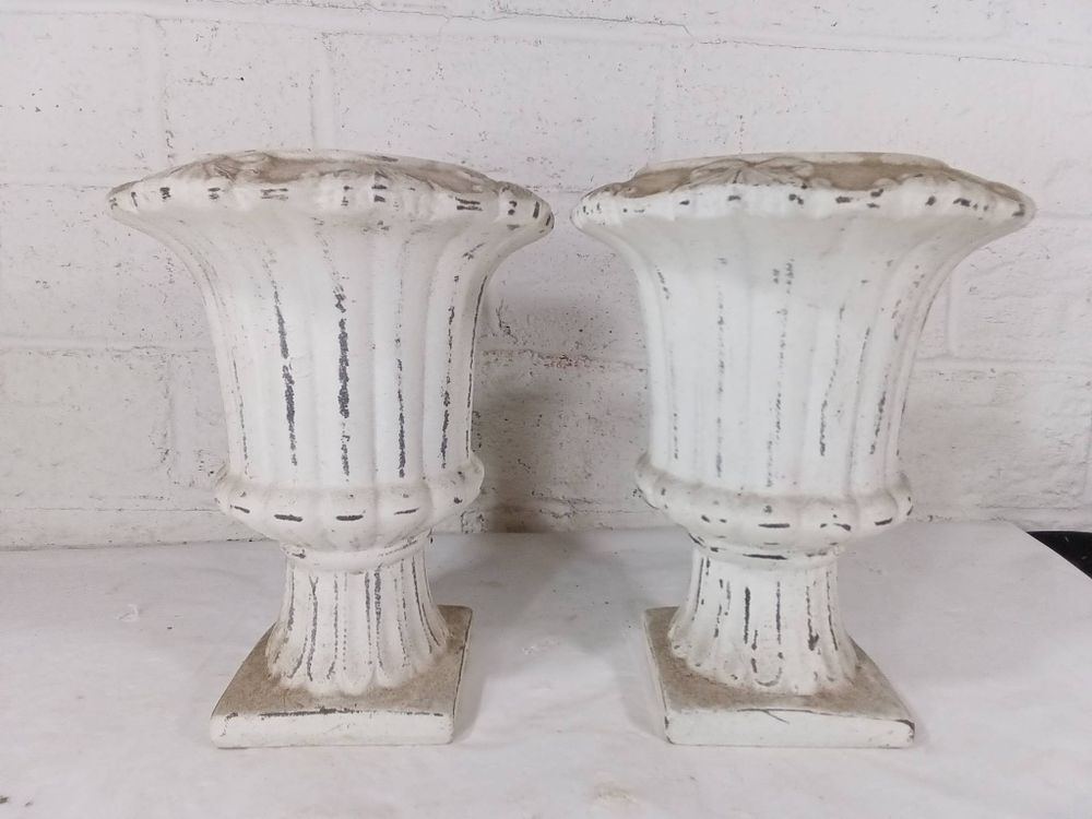 White Cast Planters with Floral Trim. Cast planters with a white-painted finish and decorative 