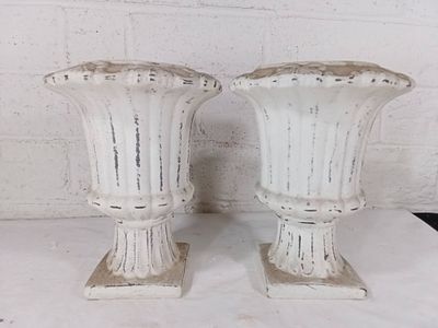 White Cast Planters with Floral Trim. Cast planters with a white-painted finish and decorative 
