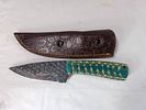 Damascus Knife with Leather Sheath. Fixed-blade knife featuring a Damascus steel blade with a Image - 1