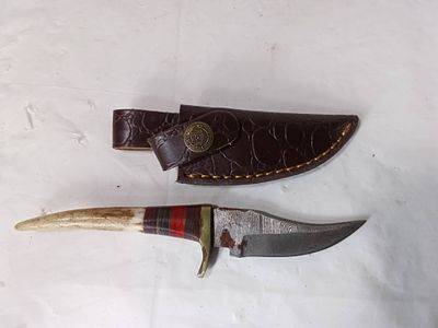 Damascus Knife with Bone Handle and Leather Sheath. Damascus knife featuring a distinctive bone 
