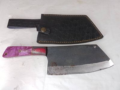 Damascus Butcher Knife with Sheath. Butcher knife featuring a Damascus steel blade with visible 