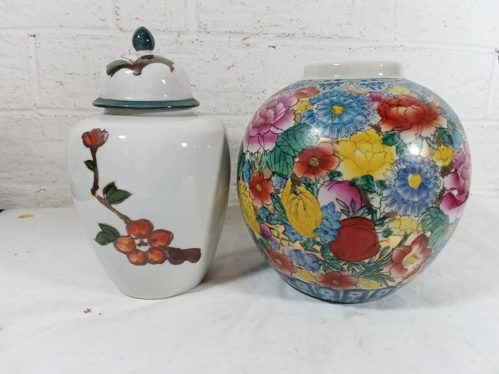 Chinese Ceramic Vases with Floral Designs. Chinese ceramic vases featuring floral motifs. One 