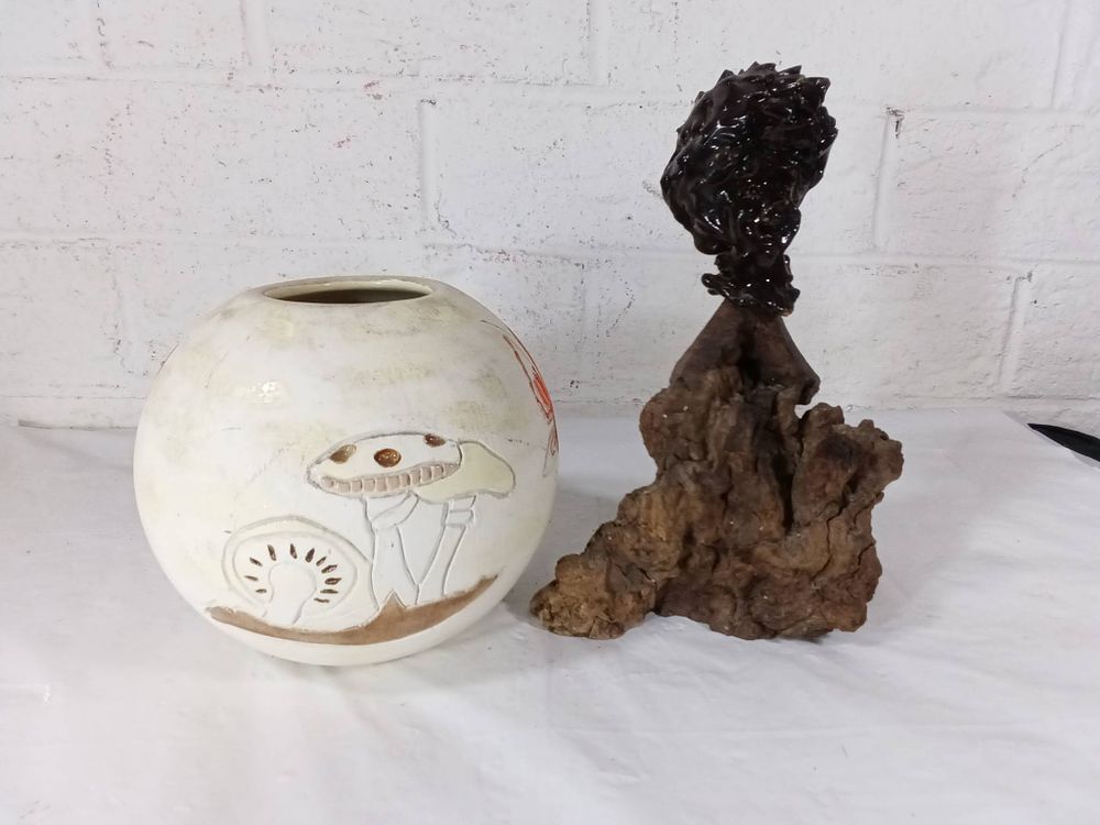 Home Decor Lot with Ceramic Vase and Sculpture. Home decor lot featuring a circular ceramic vase 