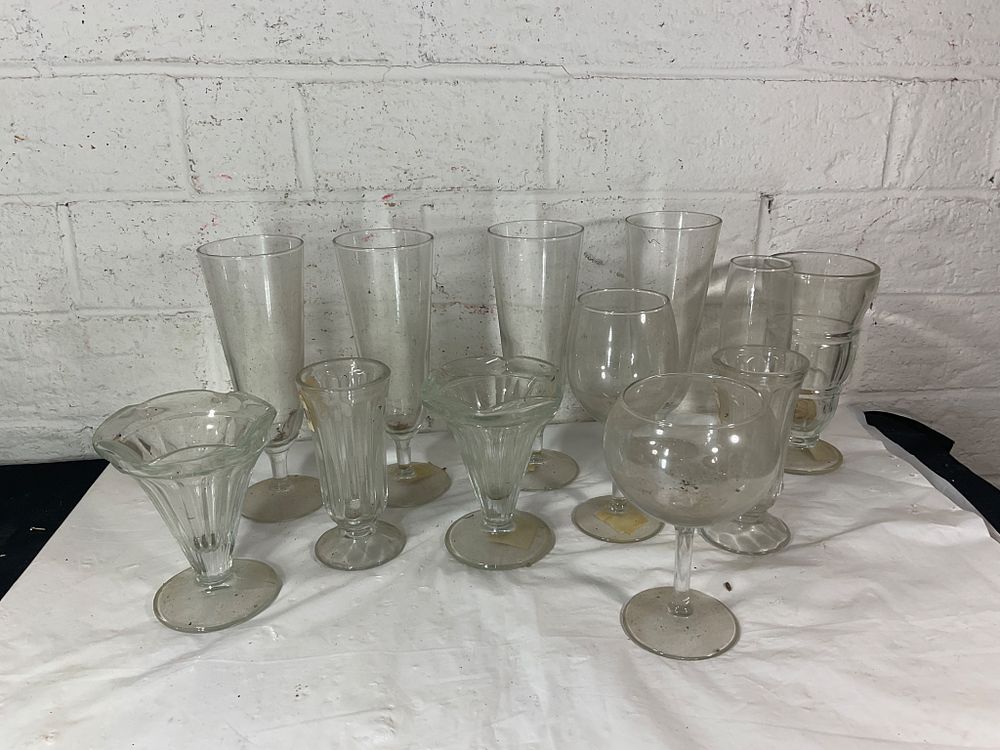 Clear Glass Stemware Collection. Clear glass stemware comprising a variety of shapes and sizes 