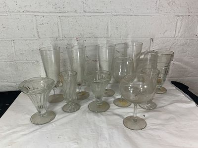 Clear Glass Stemware Collection. Clear glass stemware comprising a variety of shapes and sizes 