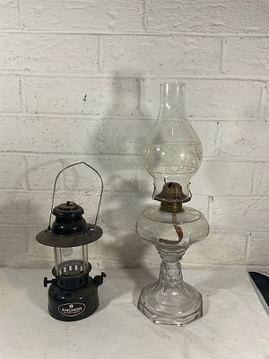 Glass Oil Lamp and Tangra Kerosene Lantern. Two lamps, including a clear glass oil lamp with a 