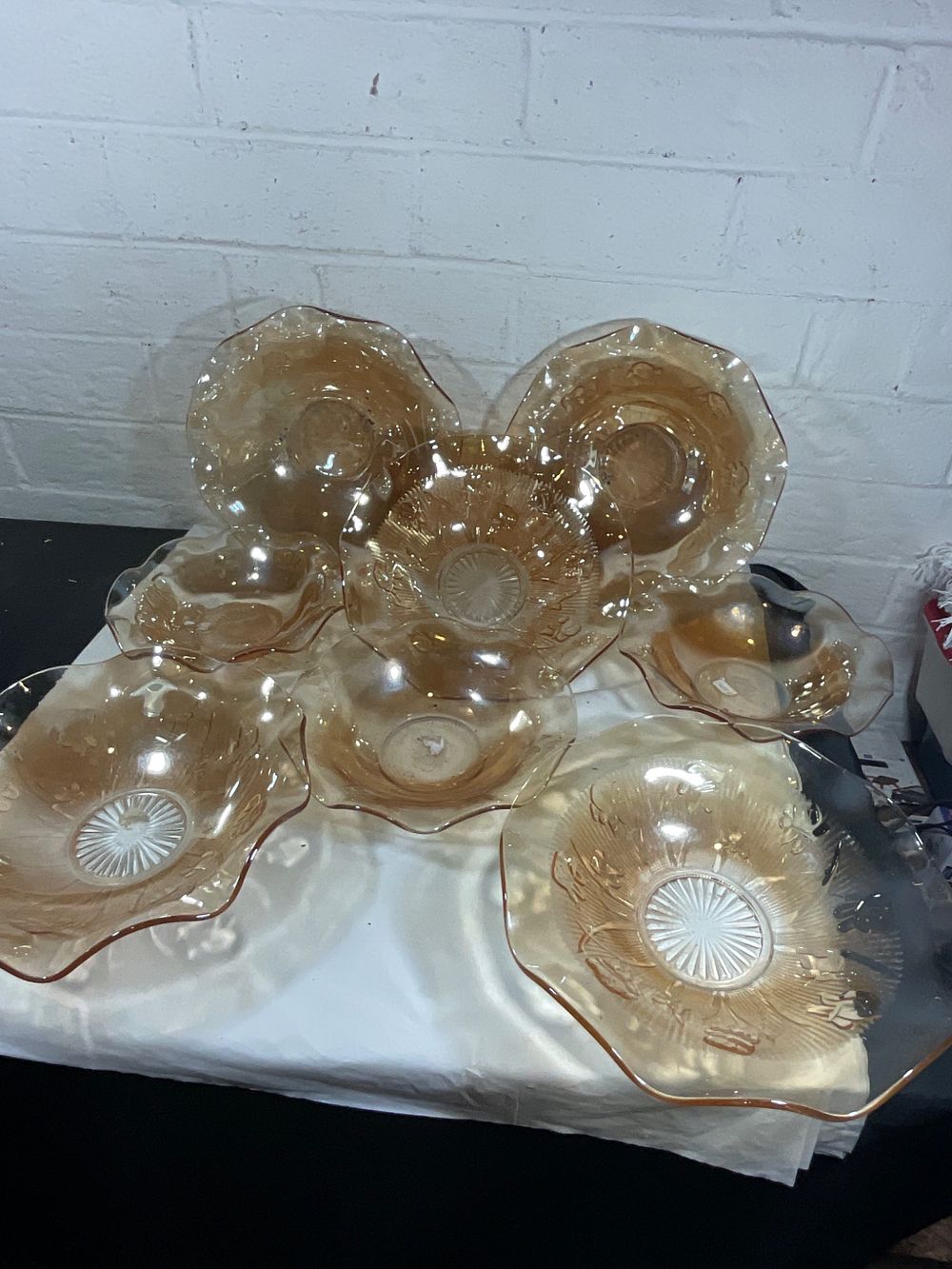 Amber Glass Serving Bowls. Amber-colored glass serving bowls, featuring a wavy rim design and 