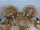 Amber Glass Serving Bowls. Amber-colored glass serving bowls, featuring a wavy rim design and Image - 1