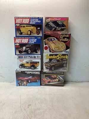 Eight Model Car Kits. Collection includes eight sealed model car kits from brands such as Revell 