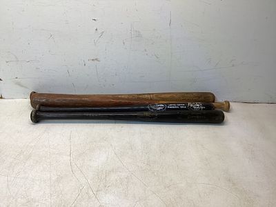 4 Wooden Baseball Bats. Four wooden baseball bats, including a Louisville Slugger Limited 