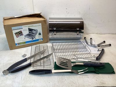 Portable Stainless Steel Grill Set. Portable stainless steel grill set including a cylindrical 