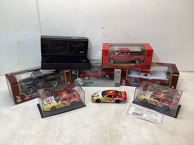 8 Die-Cast Model Cars and Memorabilia. Eight items including six die-cast model cars and related 