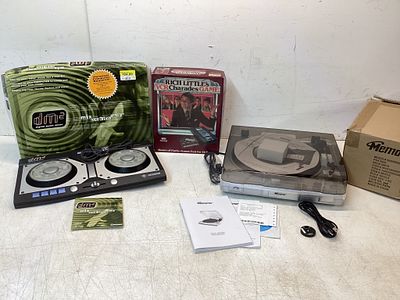 Three Boxes of Audio Equipment and Games. Three boxes containing a Mixman DM2 digital music 