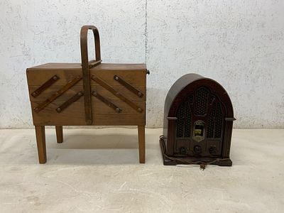 Wooden Sewing Box and Cathedral-Style Radio. A wooden lift-top sewing box with expanding tiered 
