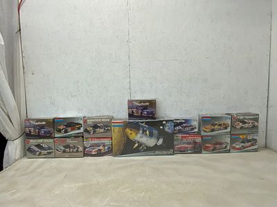 14 Model Kits Including Cars and Apollo. 14 sealed and unassembled plastic model kits featuring 