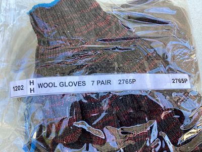 Package of 7 Pairs of Wool Gloves. Sealed package containing 7 pairs of wool gloves. The gloves 