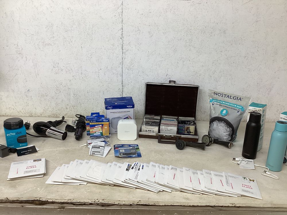 Electronics, Media, and Accessories. Lot including 13 music cassette tapes in a carrying case 