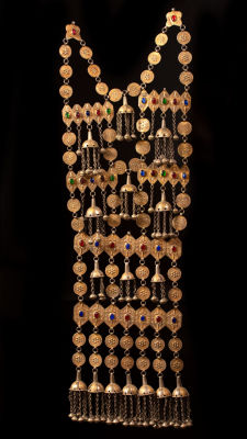 A massive gilded silver chest ornament - Turkestan 1900. The chest ornament is comprised of 2 