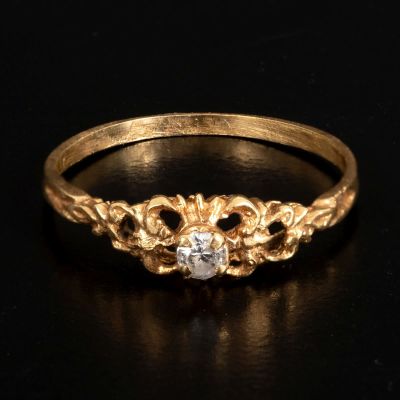 An old solitaire ring made of 14K gold with cubic zirconia. An old solitaire ring made of 14K 