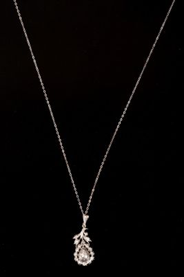 14K white gold necklace w/ a silver pendant & diamonds. Antique silver pendant adorned with 