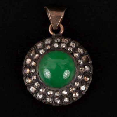 Antique 9K Gold, Jade and Diamond Pendant. containing one round cabochon cut green jade 