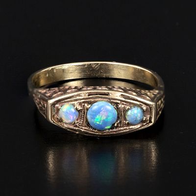 Vintage 14K Yellow Gold and Opal Ring. containing three round cabochon cut opals. 
Weight: 2.08 