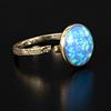 9 Karat Yellow Gold and Opal Ring. a lovely design containing one round cabochon cut opal Image - 1