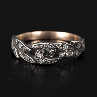 Antique 14K Gold, Silver and Diamond Ring. constructed in a floral design, containing 14 round 