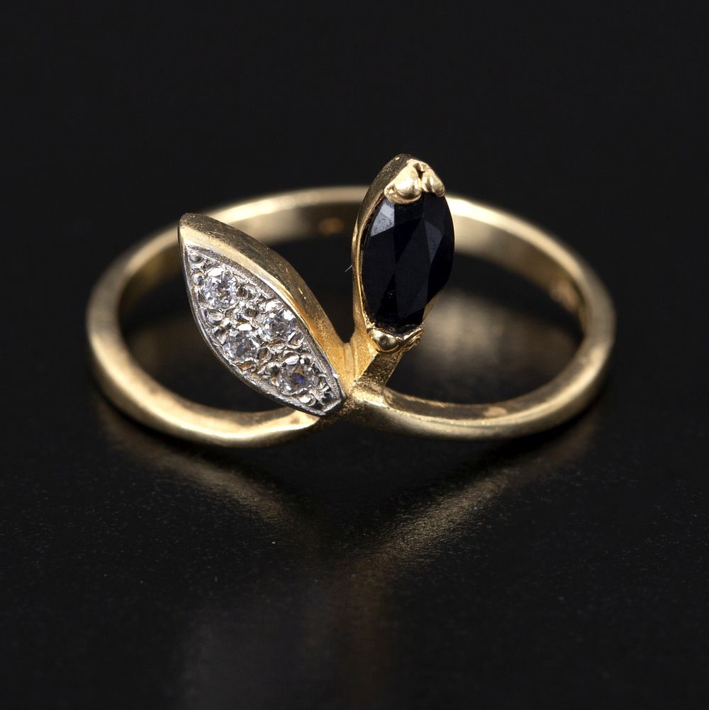 14K Gold, Sapphire and Diamond Ring. a lovely ring containing one marquise shape mixed cut 