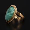 Vintage 14K Yellow Gold and Gemstone Ring. containing one oval shape cabochon cut malachite Image - 1