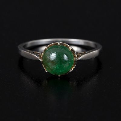 Antique Platinum and Emerald Ring. containing one round cabochon cut emerald weighing 