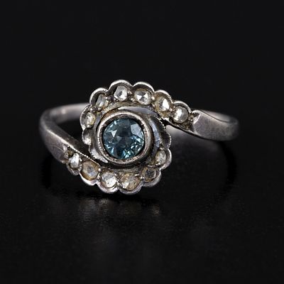 Antique Silver, Gemstone and Diamond Ring. containing one round sapphire and numerous small rose 