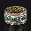 Gold, Silver, Emerald and Diamond Ring. containing eight oval shape mixed cut emeralds weighing Image - 1
