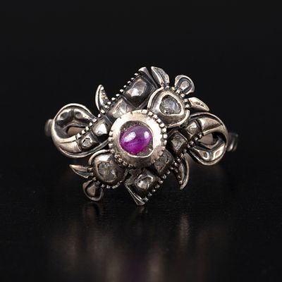 Antique gold Silver, Ruby and Diamond Ring. a Victorian ring containing one round cabochon cut 