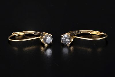 14K Yellow Gold and Diamond Earrings. containing two round brilliant cut diamonds weighing 
