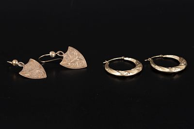 A Collection of Yellow Gold Earrings. two pairs, the first is 14K yellow gold hoops and the 