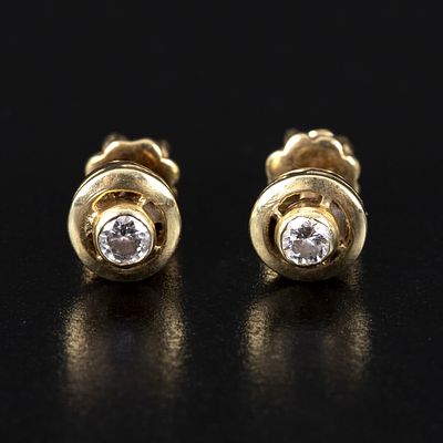 14K Yellow Gold and Diamond Earrings. screw-on backings, bezel set with two round brilliant cut 