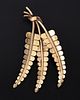Vintage 14K Yellow Gold Leaf Brooch. crafted in the form of three leaves. 
Stamp: (maker's mark) Image - 1