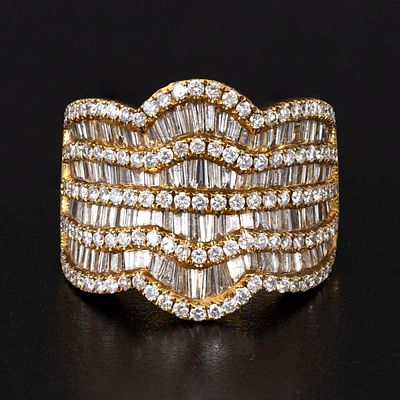 An 18K Yellow Gold and 3.4 Carats Diamond Ring. an impressive ring containing numerous round 
