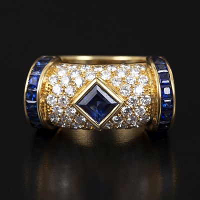 Designer 18K Gold, Sapphire and Diamond Ring. a stunning custom made ring, containing 23 square 