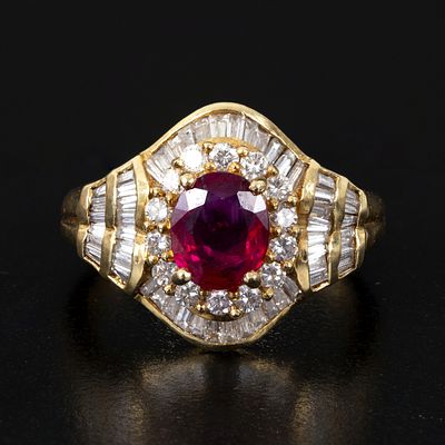 Fine 18K Gold, Ruby and Diamond Ring. an elegant ring containing one oval shape mixed cut 