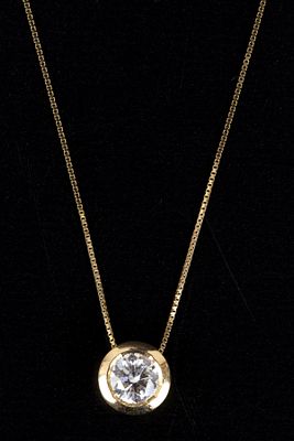 Italian 18K Yellow Gold and Diamond Necklace. Solitaire slide pendant suspended from a 44 cm 