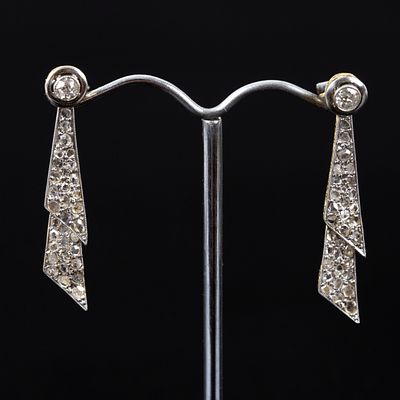 Art Deco 18K Gold and Diamond Earrings. a lovely pair of earrings in a stylized ribbon design 