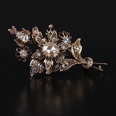 Antique 14K Gold and Diamond Floral Brooch. designed in a lovely bouquet, containing numerous 