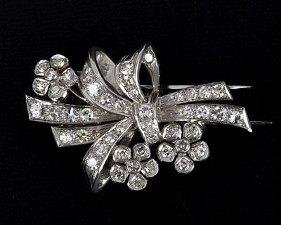 Art Deco Platinum and Diamond Flower Brooch. lovely antique brooch, containing numerous round 